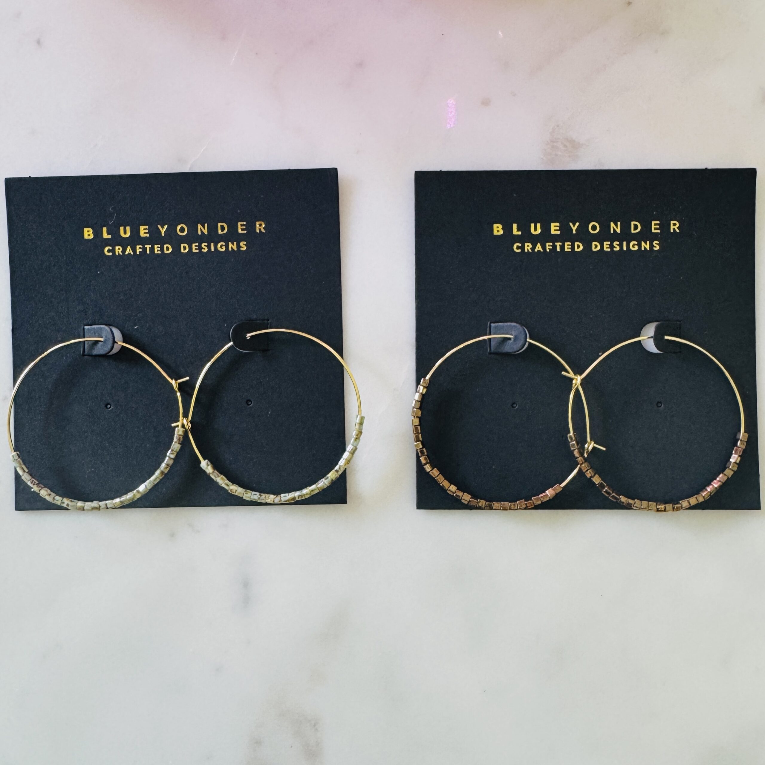 Iconic wire hoop half green marble half bronze